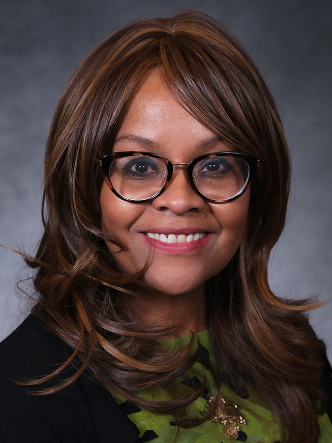 Portrait of Denise A. Lettau in warm, natural light